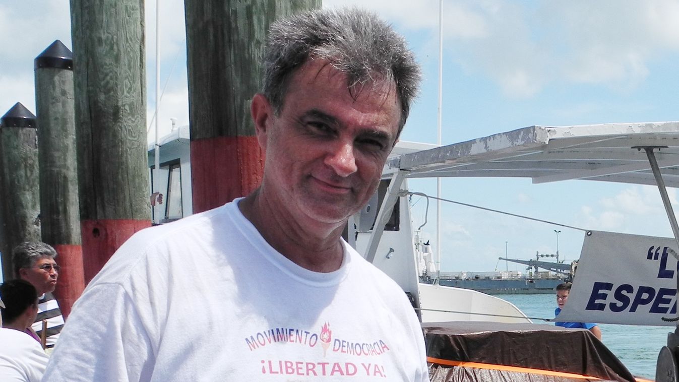 Horizontal FLOTILLA Cuban exile organization Movimiento Democracia president Ramon Saul Sanchez prepares one of the boats of the flotilla to commemorate the drowning of 37 migrants twenty years ago, on July 12, 2014 in Key West, Florida. Three boats carry