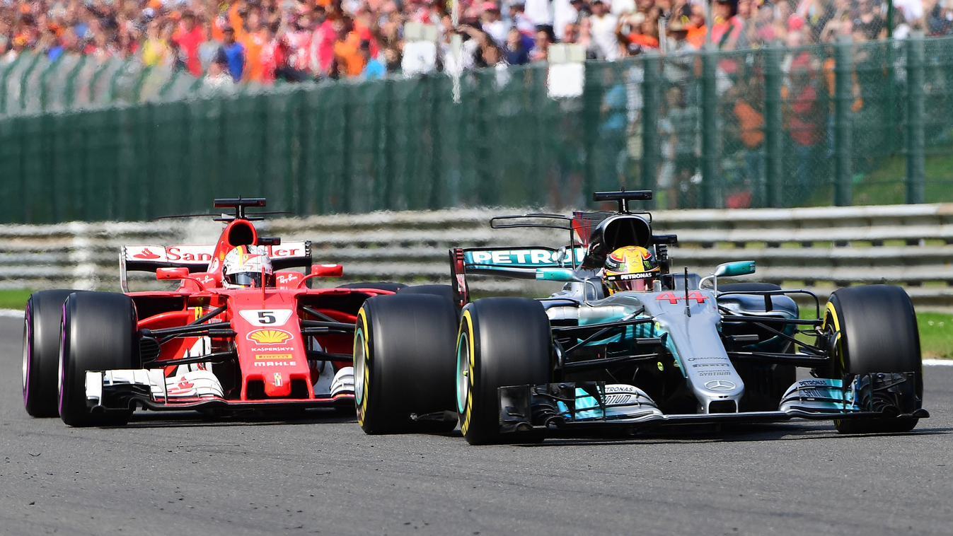 Horizontal Mercedes' British driver Lewis Hamilton drives ahead of Ferrari's German driver Sebastian Vettel  during the Belgian Formula One Grand Prix at the Spa-Francorchamps circuit in Spa on August 27, 2017. / AFP PHOTO / Emmanuel DUNAND 