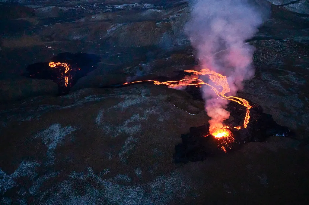 Horizontal NATURAL DISASTERS VOLCANO VOLCANO ERUPTION LAVA FLOW NIGHT Lava flows from two fissures from a volcano near along the Fagradalsfjall on the Reykjanes Peninsula in Iceland on ,April 6, 2021. - The volcanic eruption, which has been ongoing for mo