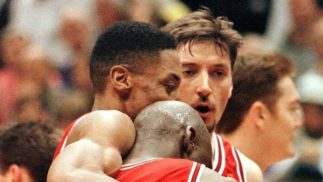 Horizontal SPORT FINAL WINNER BASKETBALL Scottie Pippen (L) hugs Chicago Bulls teammate Michael Jordan  at the end of game five of the 1997 NBA Finals 11 June at the Delta Center in Salt Lake City, Utah. Jordan scored 38 points leading the Bulls to a 90-8