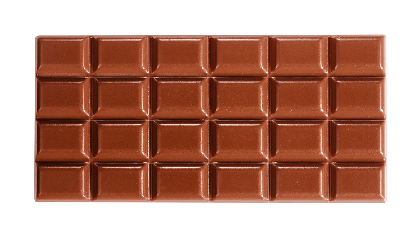 Delicious milk chocolate tablet isolated on white bar candy chili chocolate flavor isolated sugar sweets tablet white chilli hot spicy taste spice flat lay overhead whole confectionery dairy milk product dessert calories addictive Close-up from above full