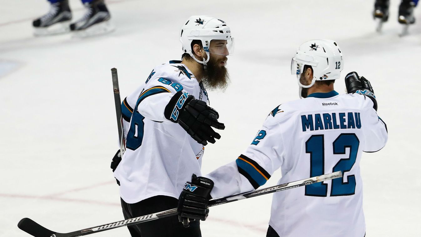 Brent Burns #88 of the San Jose Sharks celebrates with Patrick Marleau #12 after scoring a third period goal against Brian Elliott #1 of the St. Louis Blues 
