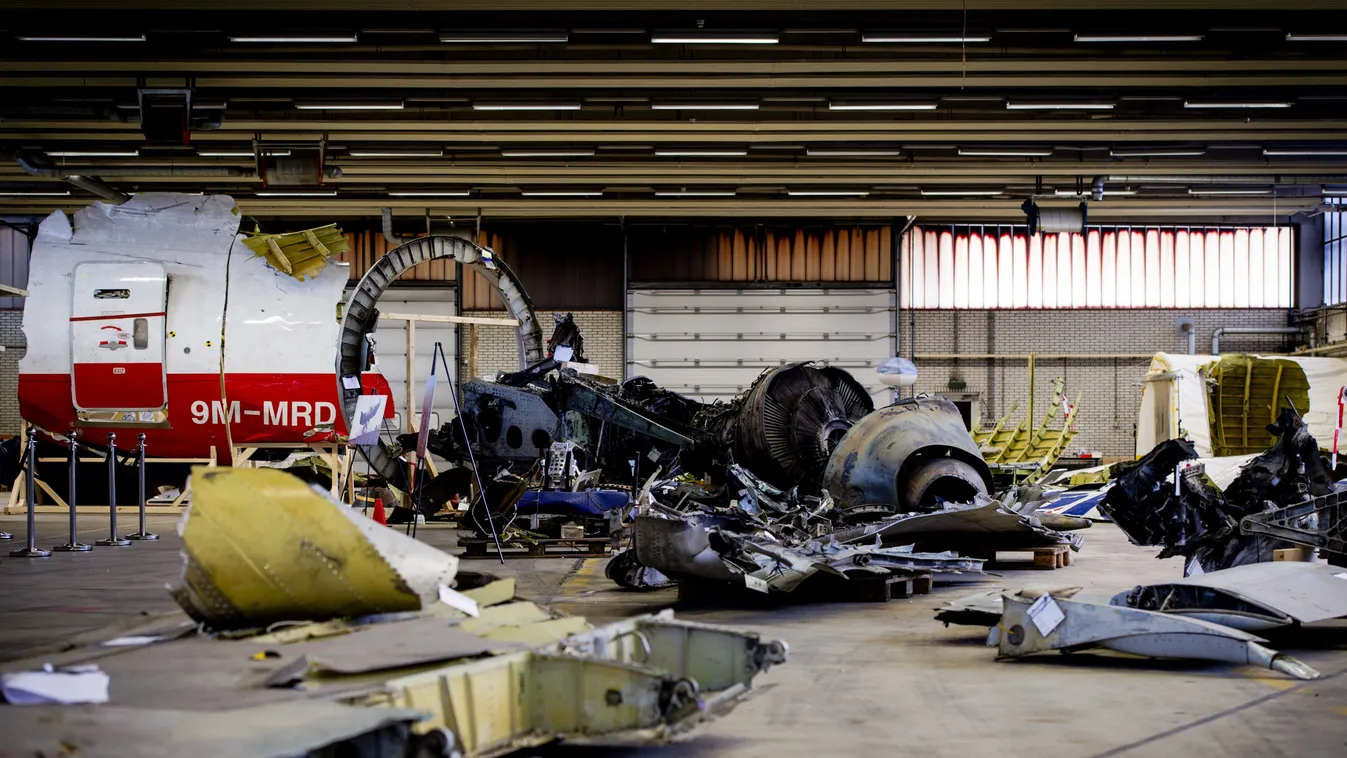 A picture taken on March 2, 2015 shows the wreckage of the Malaysia Airlines flight MH17 which was shot down over Ukraine in July 2014, laid out in a hangar on  Gilze-Rijen airbase in the southern Netherlands. The first of around 500 relatives of those ki