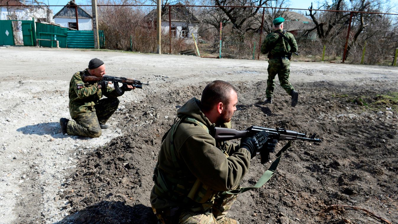 Soldiers of the self-proclaimed Donetsk People's Republic (DNR) take position in the frontline town of Shyrokyne, some 10 kms east of Mariupol, on March 20, 2015. The town, held by both DNR and Ukrainian troops, is a constant flashpoint with weekly casual