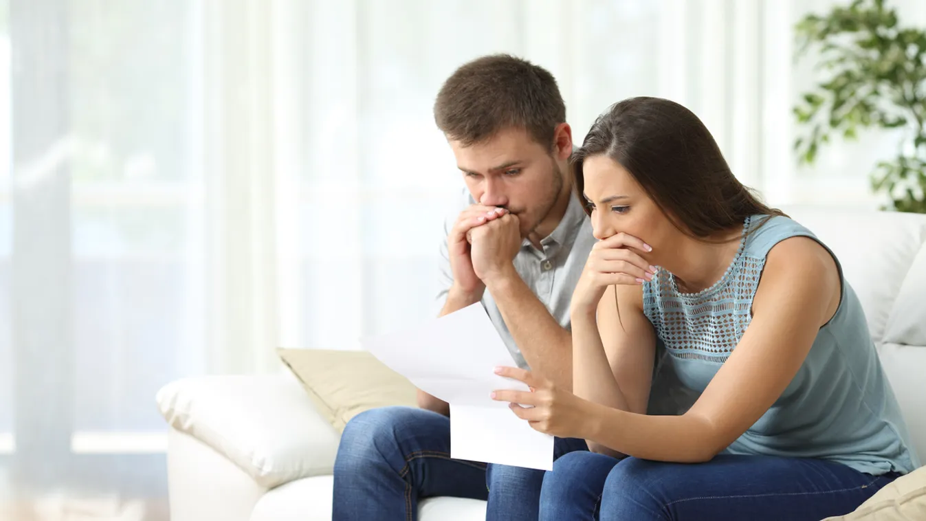 Worried couple reading a letter Couple - Relationship Roommate Bad News Debt Mail The Media Women Men Loan Insurance Tax Paying Coin Bank Bank Statement Currency Home Finances Young Adult Poverty Reading Examining Looking Holding Customer Frustration Conf