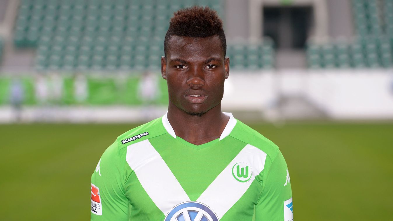 - (FILES) A picture taken on July 30, 2014 shows Wolfsburg's Belgian midfielder Junior Malanda posing for a photograph during the official presentation of German first division Bundesliga football team VfL Wolfsburg in Wolfsburg, central Germany. 20-year-