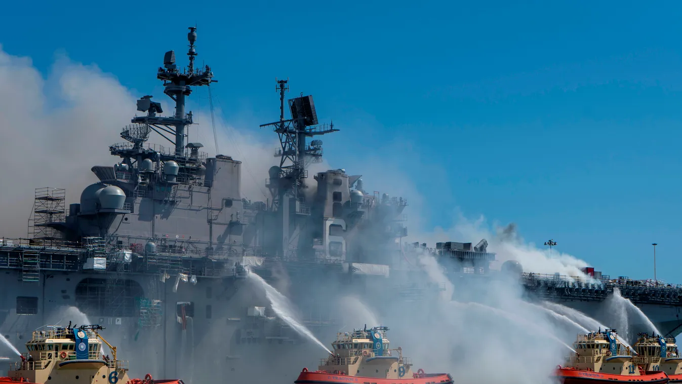 Horizontal FIRE MILITARY ACADEMY This US Navy photo released July 13, 2020 shows Sailors and Federal Firefighters combating a fire onboard the amphibious assault ship USS Bonhomme Richard (LHD 6) at Naval Base San Diego, July 12, 2020. - On the morning of