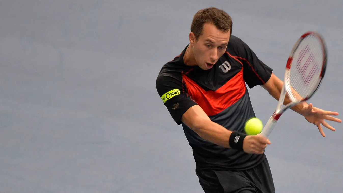 Germany's Philipp Kohlschreiber hits a return to Serbia's Novak Djokovic during a second round match at the ATP World Tour Masters 1000 indoor tennis tournament on October 28, 2014 at the Bercy Palais-Omnisport (POPB) in Paris. AFP PHOTO / MIGUEL MEDINA 