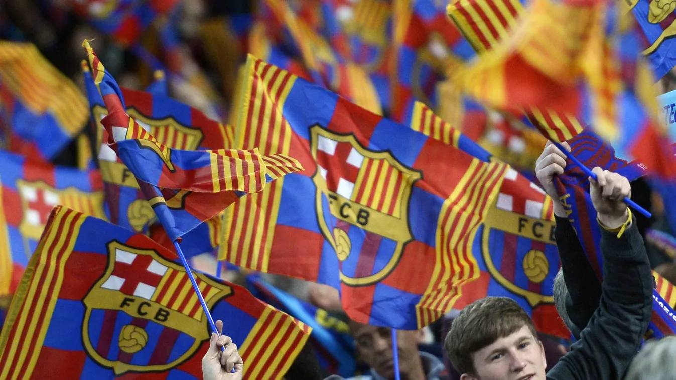 463412751 FC Barcelona's supporters wave their club's flag during the UEFA Champions League round of 16 second leg football match FC Barcelona vs Manchester City at the Camp Nou stadium in Barcelona on March 12, 2014.  AFP PHOTO / LLUIS GENE 