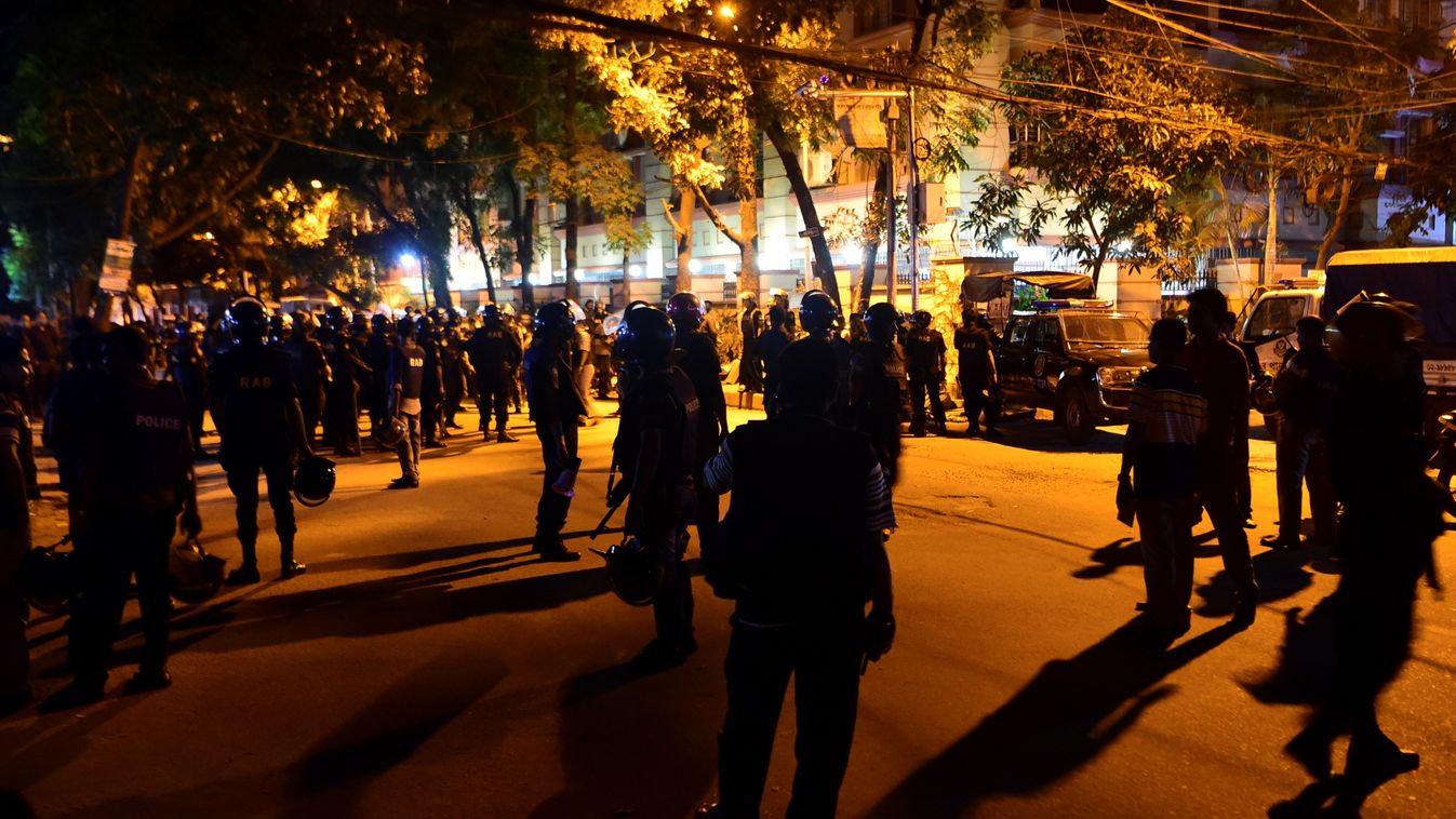 TOPSHOTS Horizontal TERRORIST ACTION NIGHT TERRORIST HOSTAGE-TAKING RESTAURANT SCENE OF THE ATTACK POLICE OFFICER (FILES) This file photograph taken on July 1, 2016, shows Bangladeshi security personnel gathering near the Holey Artisan Bakery restaurant d
