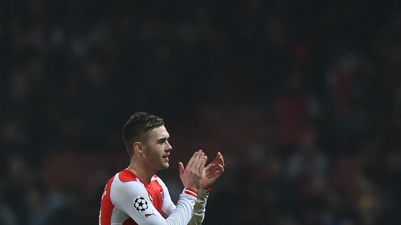 511785707 Arsenal's English defender Calum Chambers applauds the crowd after the final whistle during the UEFA Champions League Group D football match between Arsenal and Borussia Dortmund at the Emirates Stadium in north London on November 26, 2014. Arse
