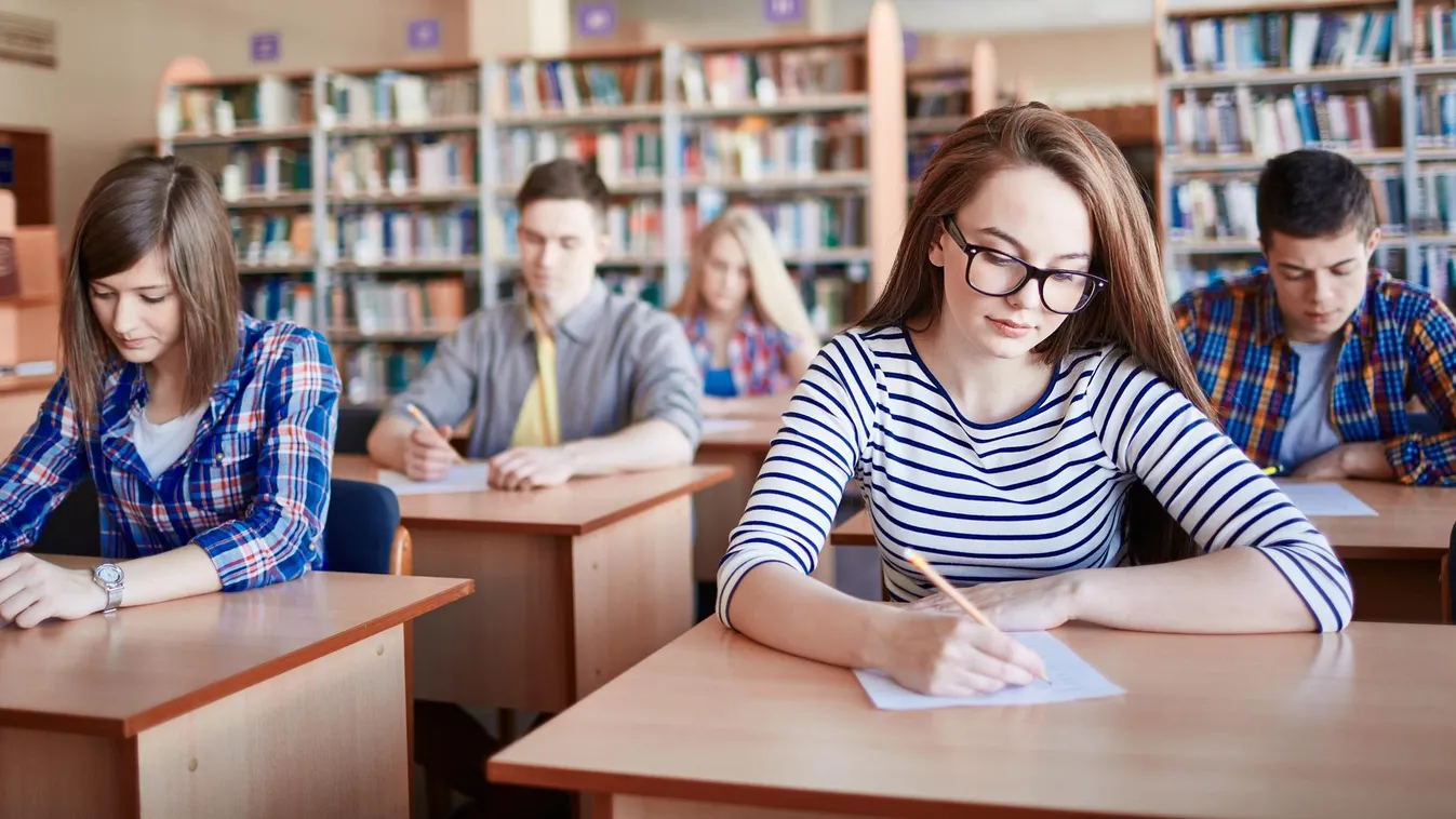Final test Student Teenage Girls Young Adult Teenager Writing Studying Intelligence Learning Caucasian Ethnicity Paper Education Serious Pensive People University Pen Exam Casual Clothing Desk Groupmate High School Serious student writing test at college 