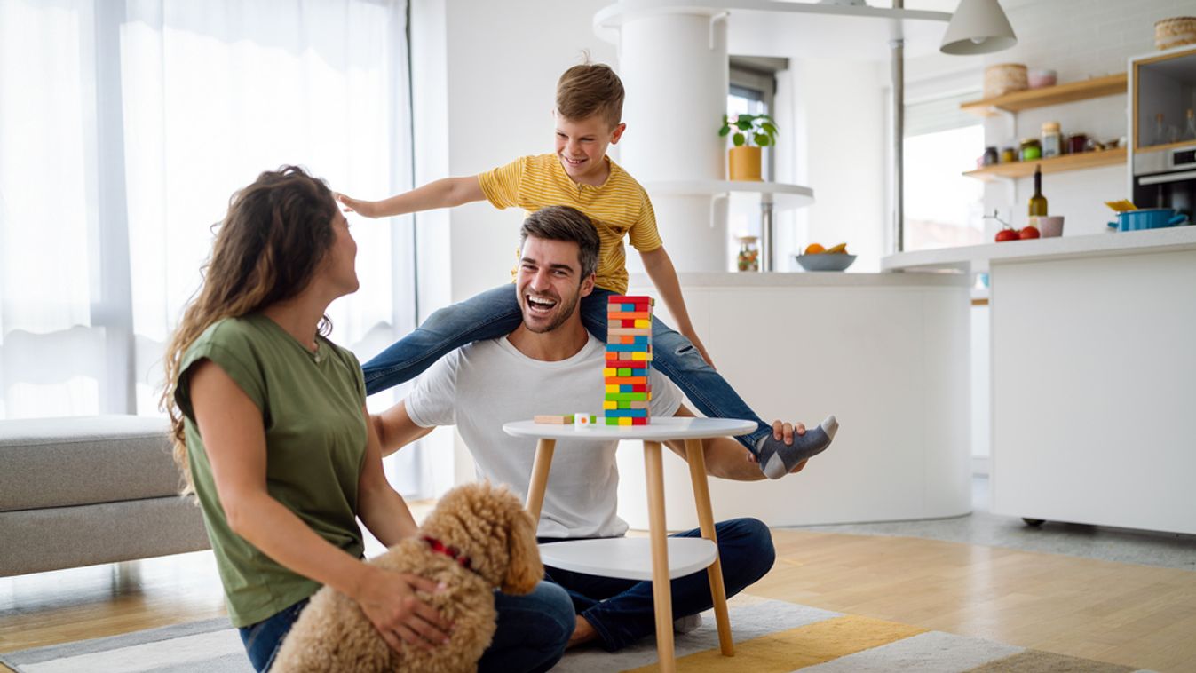 Happy family having fun, playing board game at home family game kid home parenting board happy love young play dog pet people son mother lifestyle leisure together smiling lockdown quarantine covid-19 indoors fun father boy child parents playing woman pla