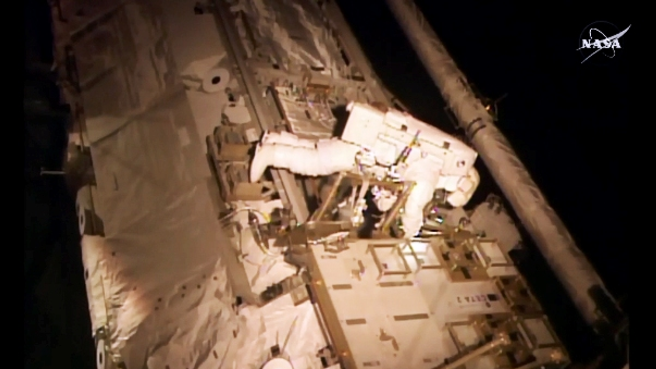 This NASA TV image obtained November 6, 2015 shows astronaut Scott Kelly as he makes an inspection on the International Space Station. Two US astronauts stepped out on a risky spacewalk Friday to complete the repair of an ammonia cooling system at the Int