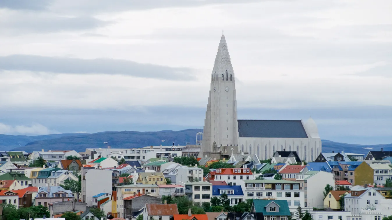 The city of Reykjavik at midnight, Iceland CATHEDRAL CHURCH City scene City skyline Daylight Homes Iceland Landmark Midnight NIGHT Phenomenon SKY ADULT adults arctic skies capital city cities cityscape day daytime HORIZONTAL housing midnight sky nighttime