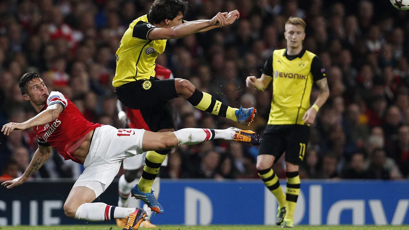 179338264 CHAMPIONS LEAGUE FOOTBALL FULL LENGH ACTION Arsenal's French striker Olivier Giroud (L) vies with Borussia Dortmund's German defender Mats Hummels during the UEFA Champions League Group F football match between Arsenal and Borussia Dortmund at t