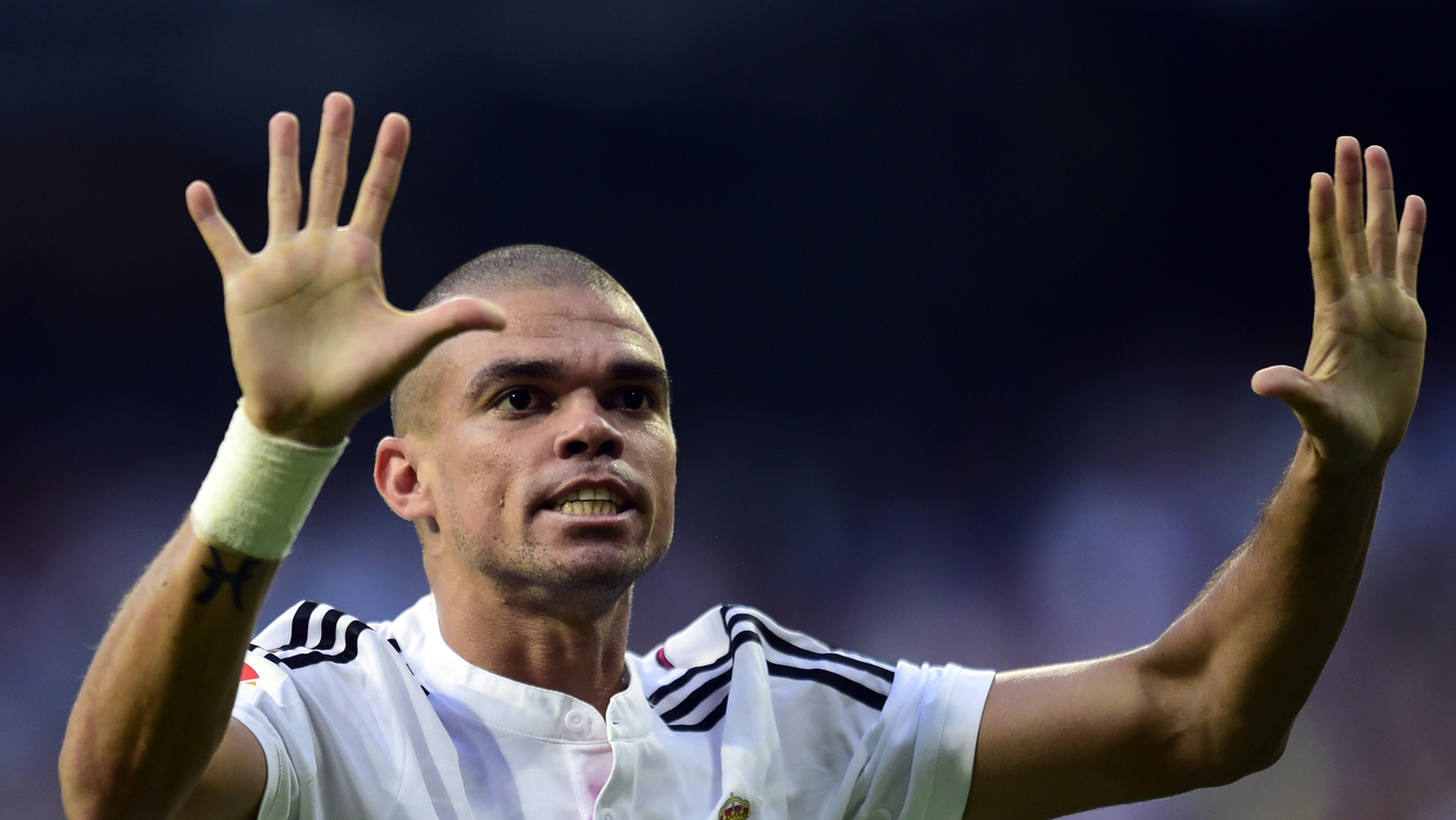 504075869 Real Madrid's Portuguese defender Pepe celebrates after scoring their second team goal during the Spanish league football match Real Madrid CF vs FC Barcelona at the Santiago Bernabeu stadium in Madrid on October 25, 2014.   AFP PHOTO/ JAVIER SO