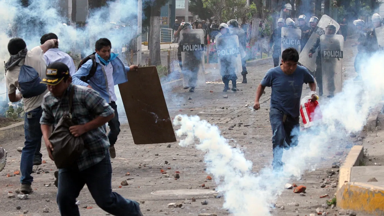 TOPSHOTS
Protesters clash with Peruvian police forces in Arequipa on May 14, 2015, opposing to a 1,400 million dollars mining project by Southern Peru in the southern region of Islay, 1100 km south of Lima, which could affect farmers in the region. Mining