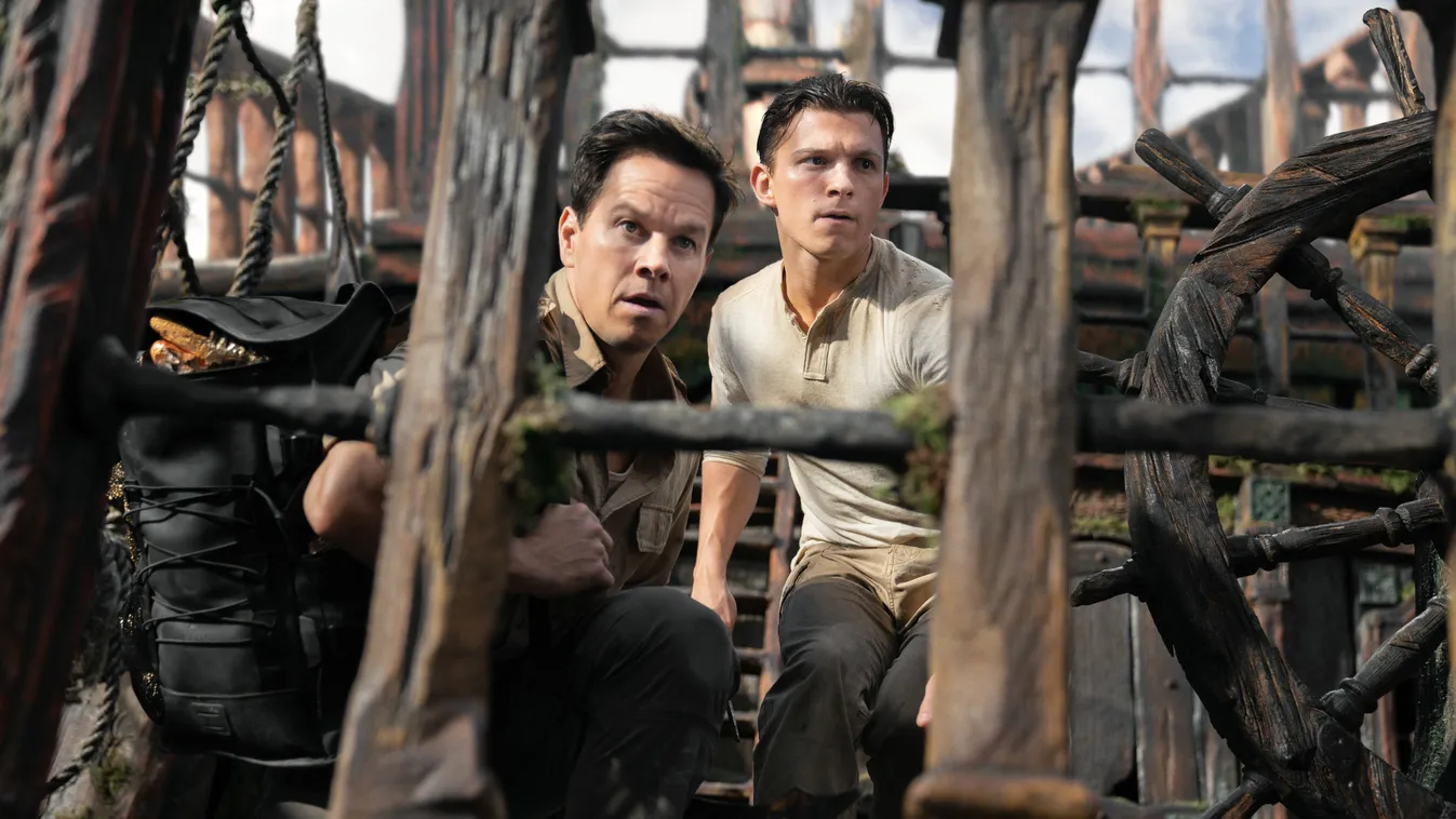 Tom Holland (Finalized);Mark Wahlberg (Finalized) Victor "Sully" Sullivan (Mark Wahlberg) and Nathan Drake (Tom Holland) look to make their move in Columbia Pictures' UNCHARTED.  photo by: Clay Enos 