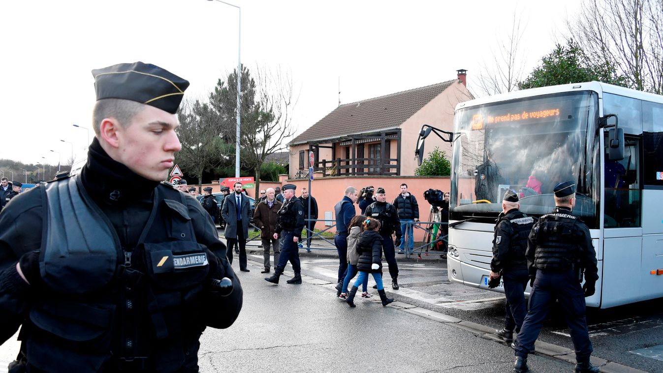 French gendarmes stand by as children are evacuted from a school in Dammartin-en-Goele, north-east of Paris, where two brothers suspected of slaughtering 12 people in an Islamist attack on French satirical newspaper Charlie Hebdo held one person hostage a