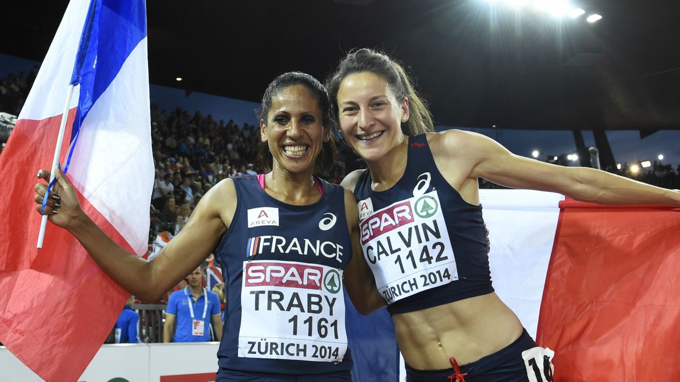 France's Clemence Calvin (R) and France's Laila Traby celebrates after taking silver and bronze in the Women's 10,000m final during the European Athletics Championships 