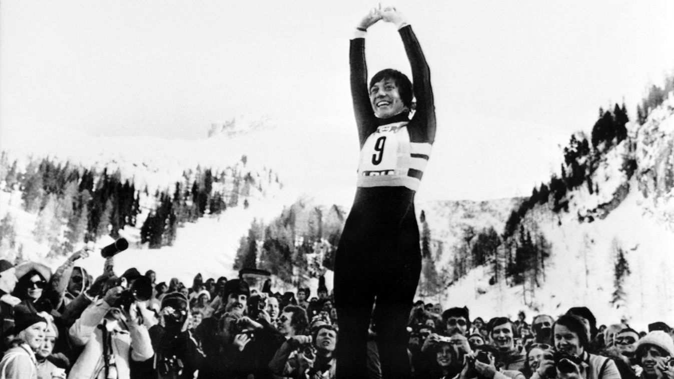 Horizontal ALPINE SKIING OLYMPIC GAMES WINTER OLYMPIC GAMES WINNER SMILING JOY HANDS IN THE AIR PRESS PHOTOGRAPHER SPORTS FAN WOMEN'S BLACK AND WHITE PICTURE 