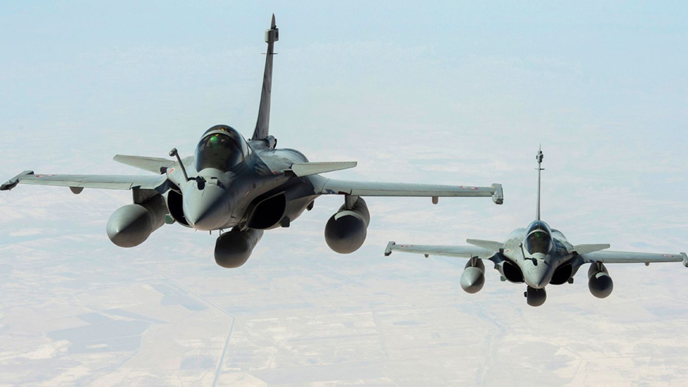 A handout picture taken and released on September 15, 2014 by ECPAD shows two Rafale fighter jets flying on a reconnaissance mission over Iraq after taking off from the Al-Dhafra base in the United Arab Emirates. The world's top diplomats pledged on Septe