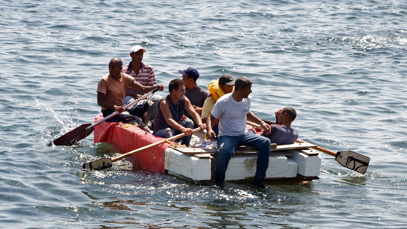 Horizontal VERTICAL Seven would-be Cuban emigres remain in a homemade boat moments before being arrested by Cuban military agents after their attempt to escape from the island nation was thwarted by the sea currents, on June 4, 2009 in Havana. The boat-pe