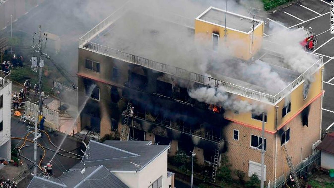 Smoke billows from a three-story building of Kyoto Animation in a fire in Kyoto, western Japan, Thursday, July 18, 2019. Kyoto prefectural police said the fire broke out Thursday morning after a man burst into it and spread unidentified liquid and put fir