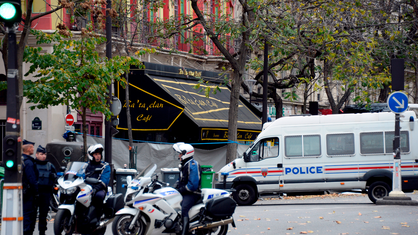 Police stands guard at the cordoned off crime scene of the Bataclan concert hall on November 16, 2015 in Paris, three days after the terrorist attacks that left over 130 dead and more than 350 injured. France prepared to fall silent at noon on November 16