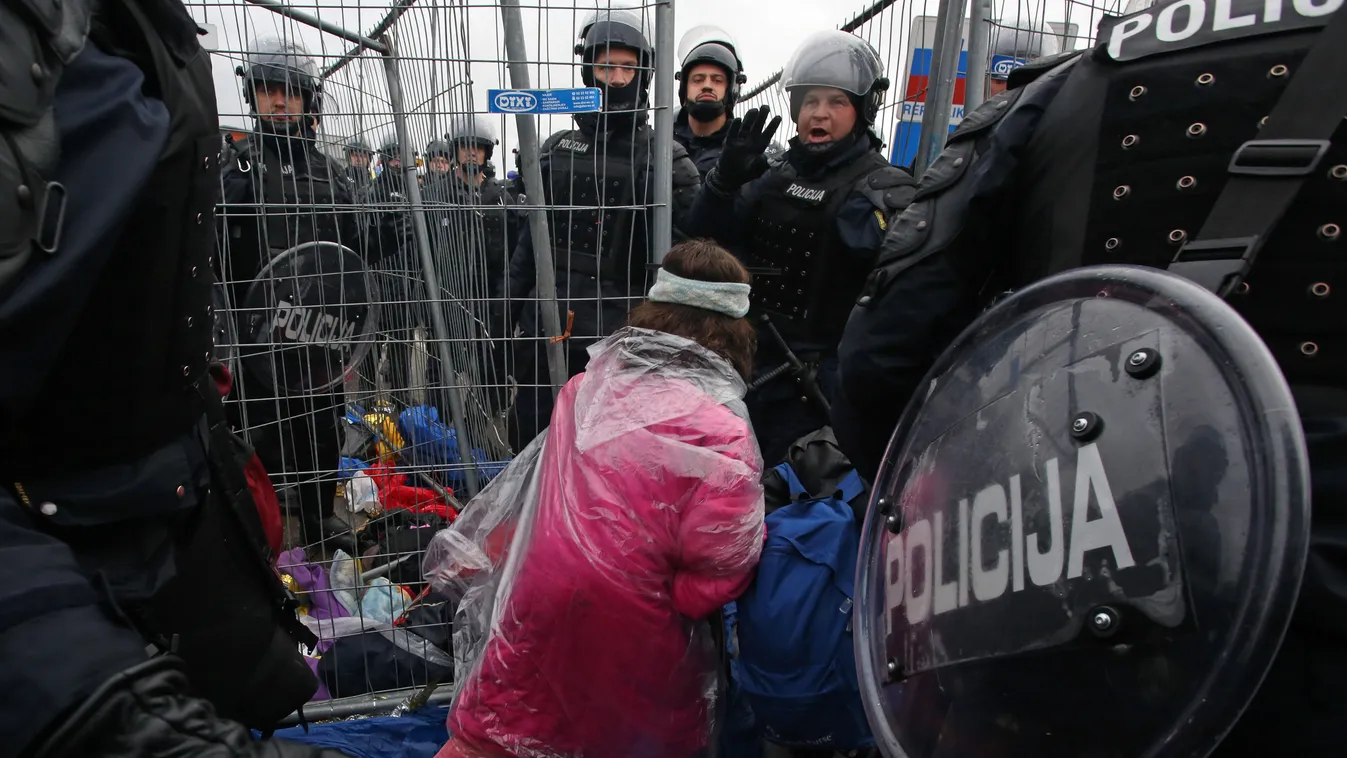 Migrants and refugees cross the Croatia-Slovenia border on October 19, 2015 in Trnovec. Slovenian authorities said on October 19 they had refused to let in more than 1,000 migrants arriving from Croatia after a daily quota had been reached, stoking fears 