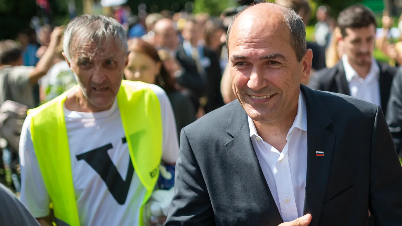 Former Slovenian Prime Minister Janez Jansa smiles after holding a speech for his supporters during a break at the Inaugural Session of the Slovenian Parliament in Ljubljana on August 1, 2014. Janez Jansa, serving a two-year prison term for corruption, ha