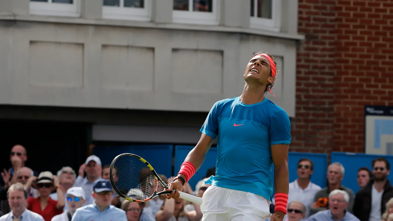 Spain's Rafael Nadal reacts during his first round men's singles match against Ukraine's Alexandr Dolgopolov on the second day of the ATP Aegon Championships tennis tournament at the Queen's Club in west London on June 16, 2015. Dolgopolov won 6-3, 6-7, 6