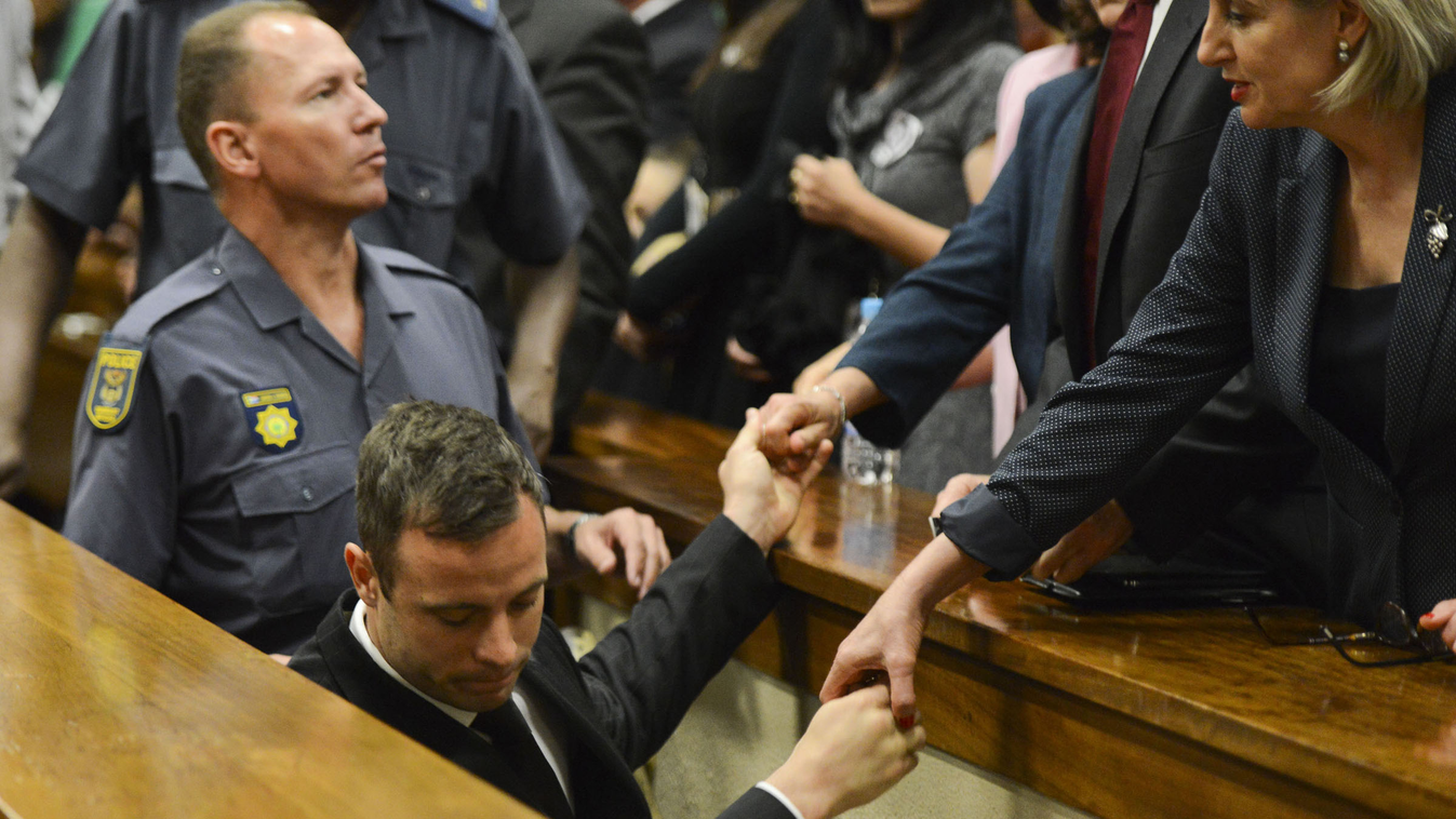 Oscar Pistorius Reeva Steenkamp Paralympian Oscar Pistorius holds the hands of family members as he is taken down to the holding cells after being sentenced to five years imprisonment for the culpable homicide killing of his girlfriend Reeva Steenkamp at 