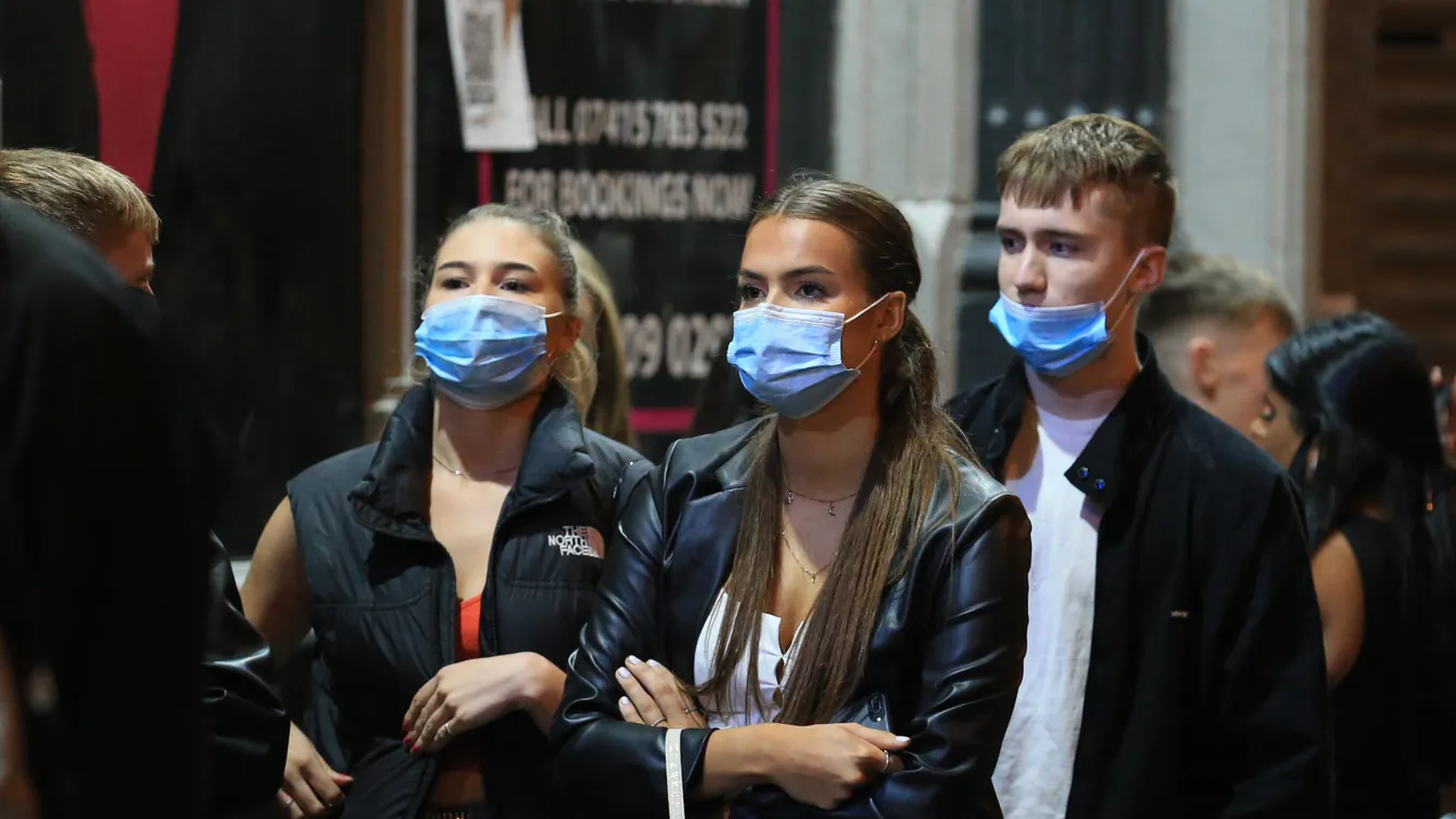 pandemic disease retail beverage Horizontal CORONAVIRUS COVID-19 Revellers enjoy their night out in the centre of Liverpool, north west England on October 10, 2020 ahead of new measures set to be introduced in the northwest next week to help stem the spre