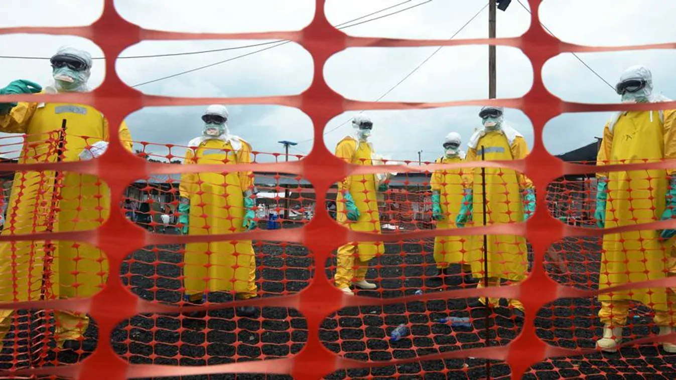 Workers wearing Personal Protective Equipment (PPE) stand inside the contaminated area at the Elwa hospital runned by Medecins Sans Frontieres (Doctors without Borders), on September 7, 2014 in Monrovia. Ebola 