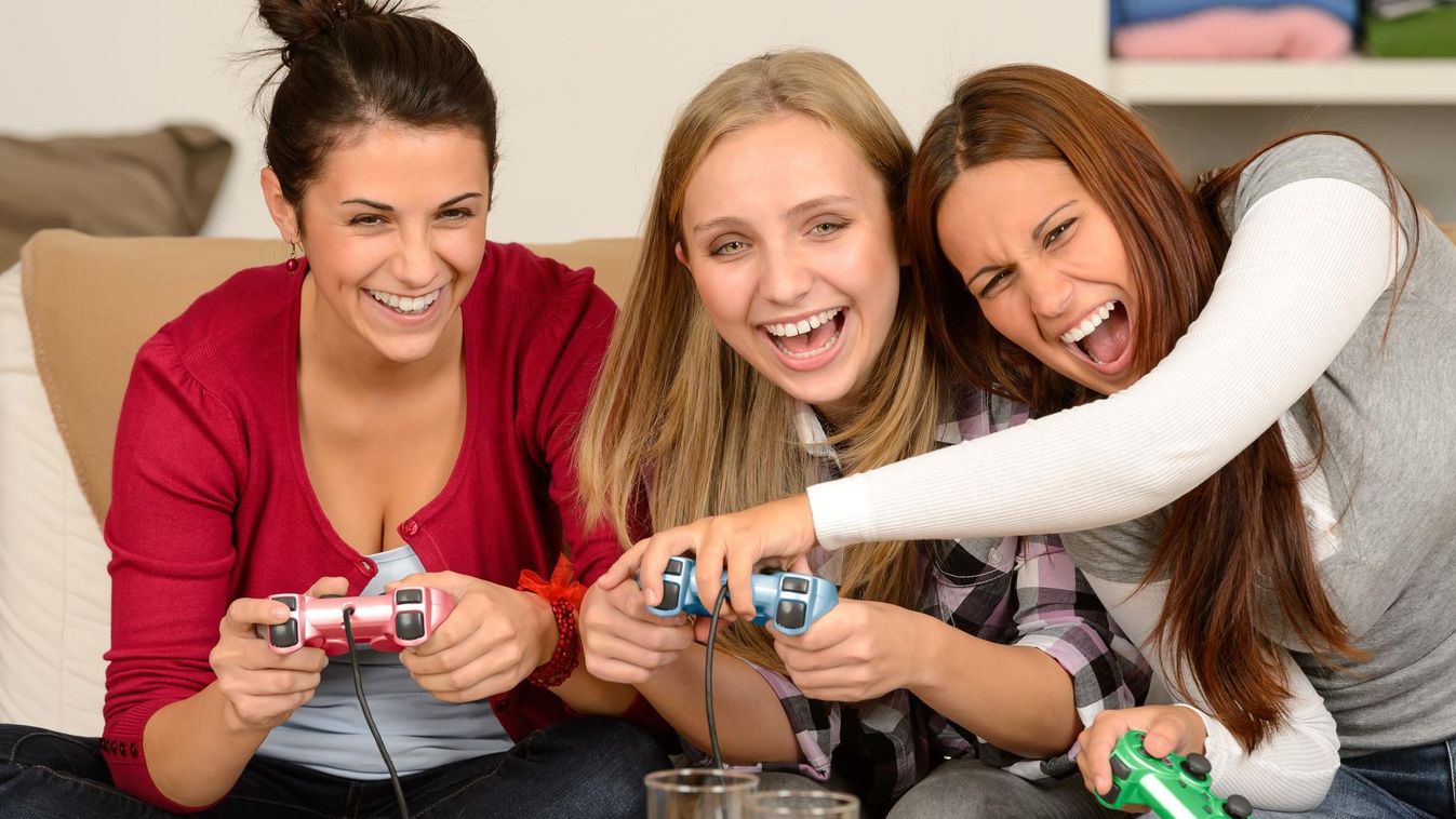 activity adolescence bowl carefree caucasian chips computer console drinks enjoying entertainment friends friendship fun game gaming girls happy indoor joystick laughing leisure lifestyle people playing potato relaxing sitting smiling snacks teenagers tog