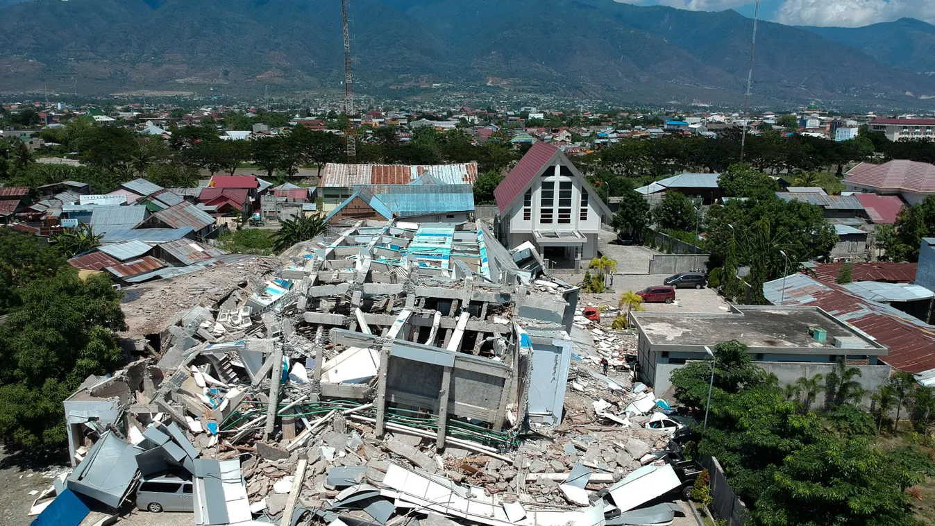 earthquake Horizontal This aerial picture shows the remains of a ten-storey hotel in Palu in Indonesia's Central Sulawesi on September 30, 2018 after it collapsed following a strong earthquake in the area.
The death toll from the powerful earthquake and t