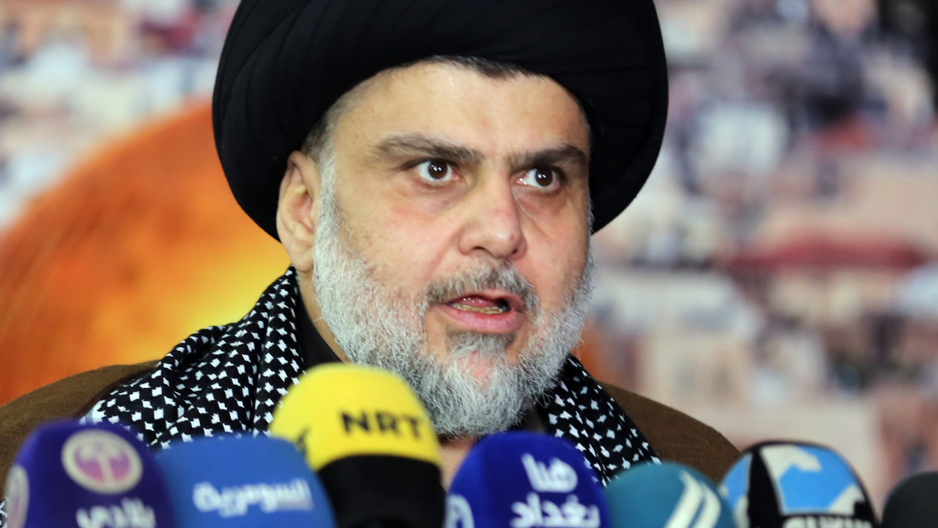 parties Horizontal Iraq's powerful Shiite cleric Moqtada al-Sadr addresses the media with a giant photo of Jerusalem's Dome of the Rock mosque in the background in the shrine city of Najaf in central Iraq on December 7, 2017 to denounce US President Donal