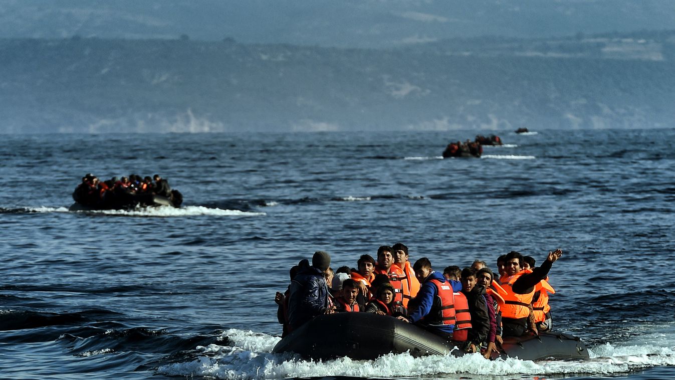 Refugees and migrants aboard dinghies reach the Greek island of Lesbos after crossing the Aegean sea from Turkey on October 4, 2015. For the thousands of refugees and migrants landing on its beaches every day, Greece's Lesbos island is a step to safety an