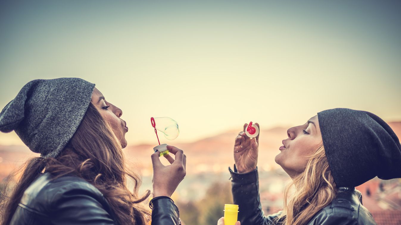 Friends having fun and blowing bubbles Beautiful Candid Non-Urban Scene Leisure Activity Only Young Women Young Women Women Beauty In Nature Soap Sud Blowing Playing Playful Fun Beauty Cap Hat Joy Happiness Friendship Simplicity Nature Lifestyles Urban Sc