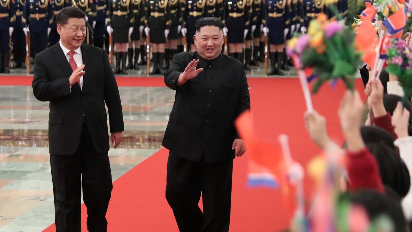 diplomacy Horizontal This photo released by China's Xinhua News Agency on January 10, 2019 shows North Korean leader Kim Jong Un (R) and China's President Xi Jinping waving to children after reviewing an honour guard during a welcome ceremony in Beijing's