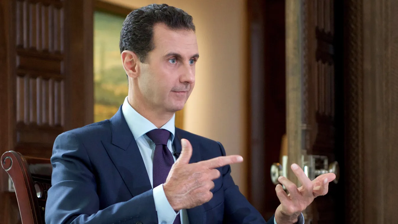 Horizontal A handout picture released by the official Syrian Arab News Agency (SANA) on October 6, 2016  shows Syrian President Bashar al-Assad speaking during an interview with Denmark's TV2 channel. / AFP PHOTO / SANA / - 