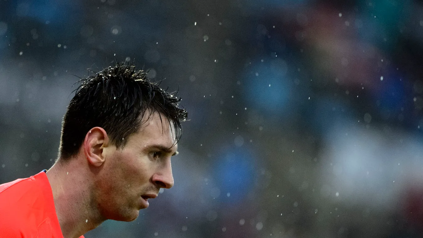 504075735 HORIZONTAL FOOTBALL PORTRAIT PROFILE Barcelona's Argentinian forward Lionel Messi walks in the rain during the Spanish league football match Getafe CF vs FC Barcelona at the Col. Alfonso Perez stadium in Getafe on December 13, 2014.  AFP PHOTO /