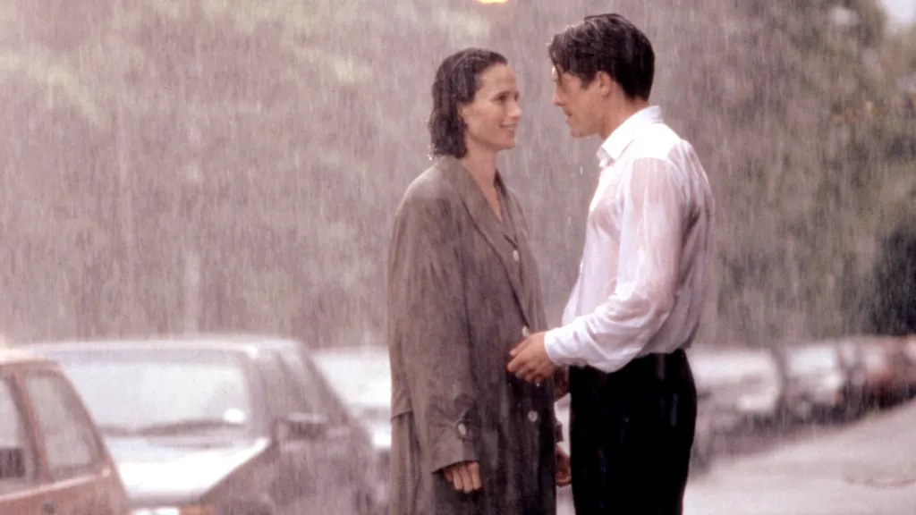 FOUR WEDDINGS AND A FUNERAL, Andie MacDowell, Hugh Grant, 1994, (c)Gramercy Pictures/courtesy Everet 1990s movies 1994 movies Grant,hugh Macdowell,andie Movies Raining Trenchcoat FOUR WEDDINGS AND A FUNERAL, Andie MacDowell, Hugh Grant, 1994, (c)Gramercy 
