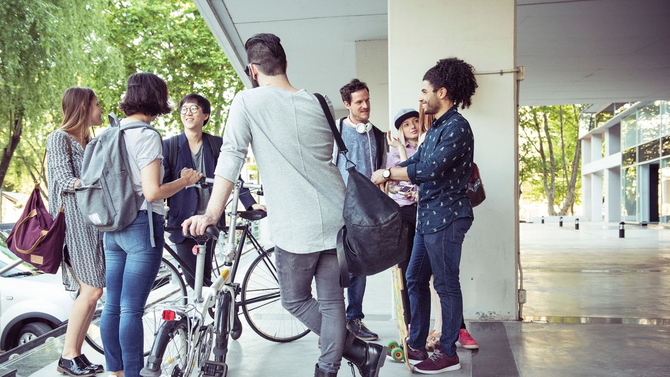 Group of coworkers chatting after work colleague STUDENT break after work college life chatting co-worker male college student group female college student hipster friend cyclist YOUNG MAN mid-adult woman young woman mixed age group MAN african american e
