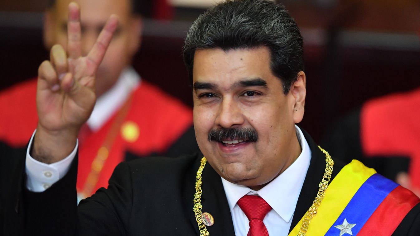 TOPSHOTS Horizontal HEADSHOT POLITICAL INAUGURATION CEREMONY VICTORY SIGN SMILING PLEASED Venezuela's President Nicolas Maduro flashes the victory sign after being sworn-in for his second mandate, at the Supreme Court of Justice (TSJ) in Caracas on Januar