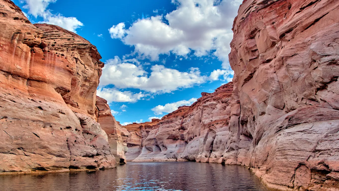 View of narrow, cliff-lined canyon from a boat in Glen Canyon National Recreation Area, Lake Powell, Arizona

USA 