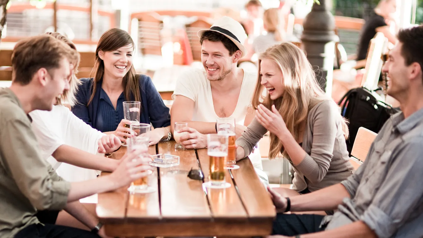 Young people drinking beer outdoors Beautiful Male Beauty Young Couple Photography Leisure Activity Number 6 Portrait Women Female Men Male Four People Medium Group Of People Group Of People Fine Art Portrait Beer Glass Color Image 20s Young Adult Smiling