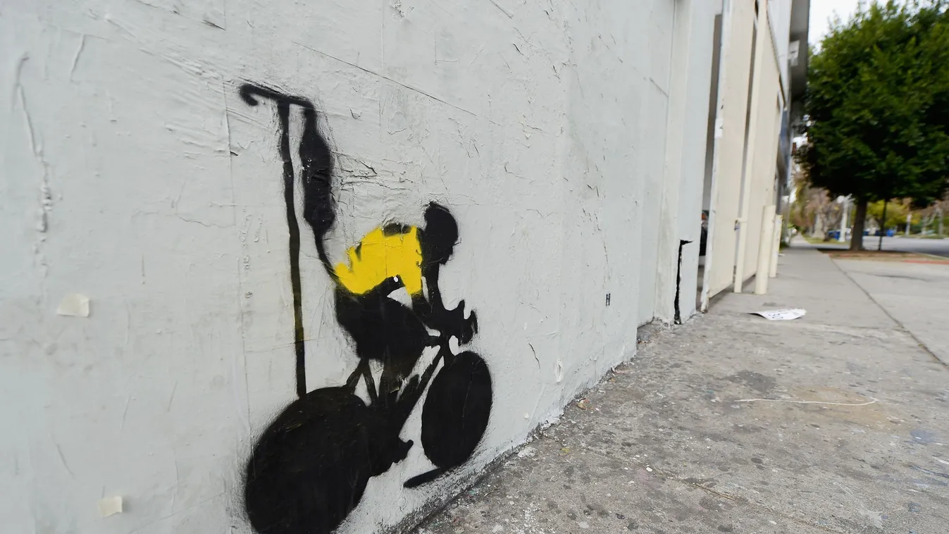 Stencil Graffiti Depicts Lance Armstrong In Yellow Jersey With IV Drip CYCLING Human Interest GettyImageRank2 